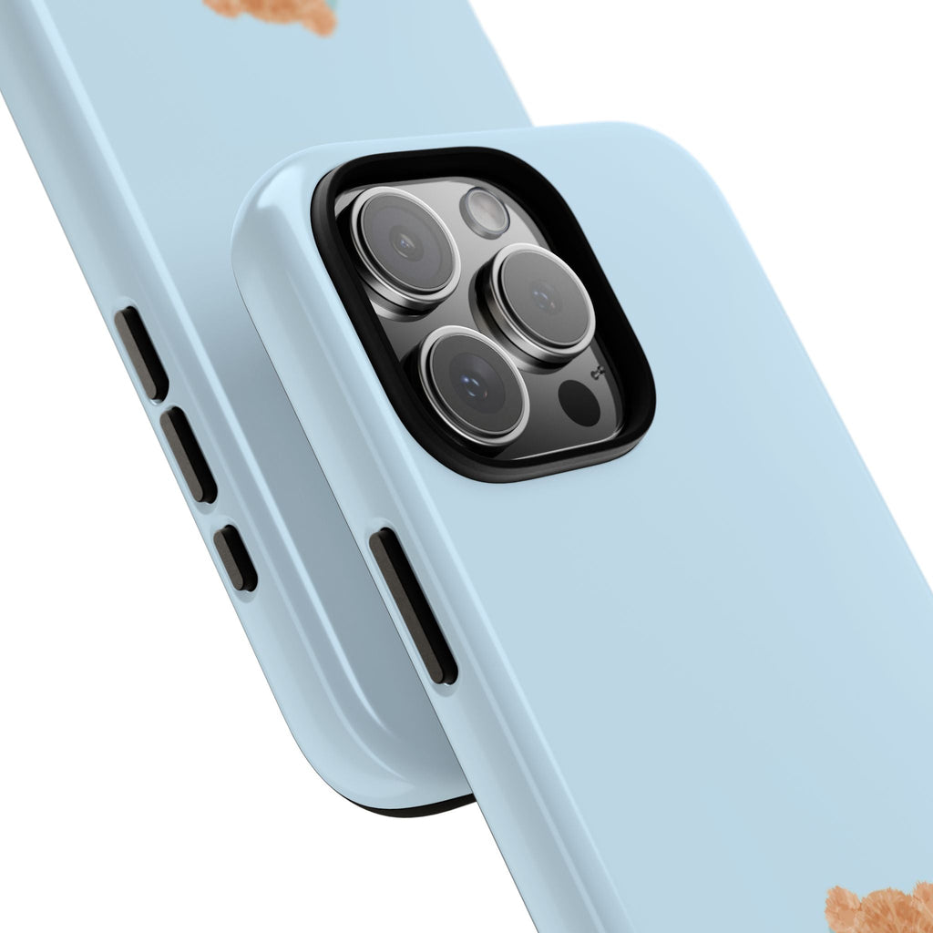 Sky blue phone case corner close-up with teddy accent, side ports, and camera lenses