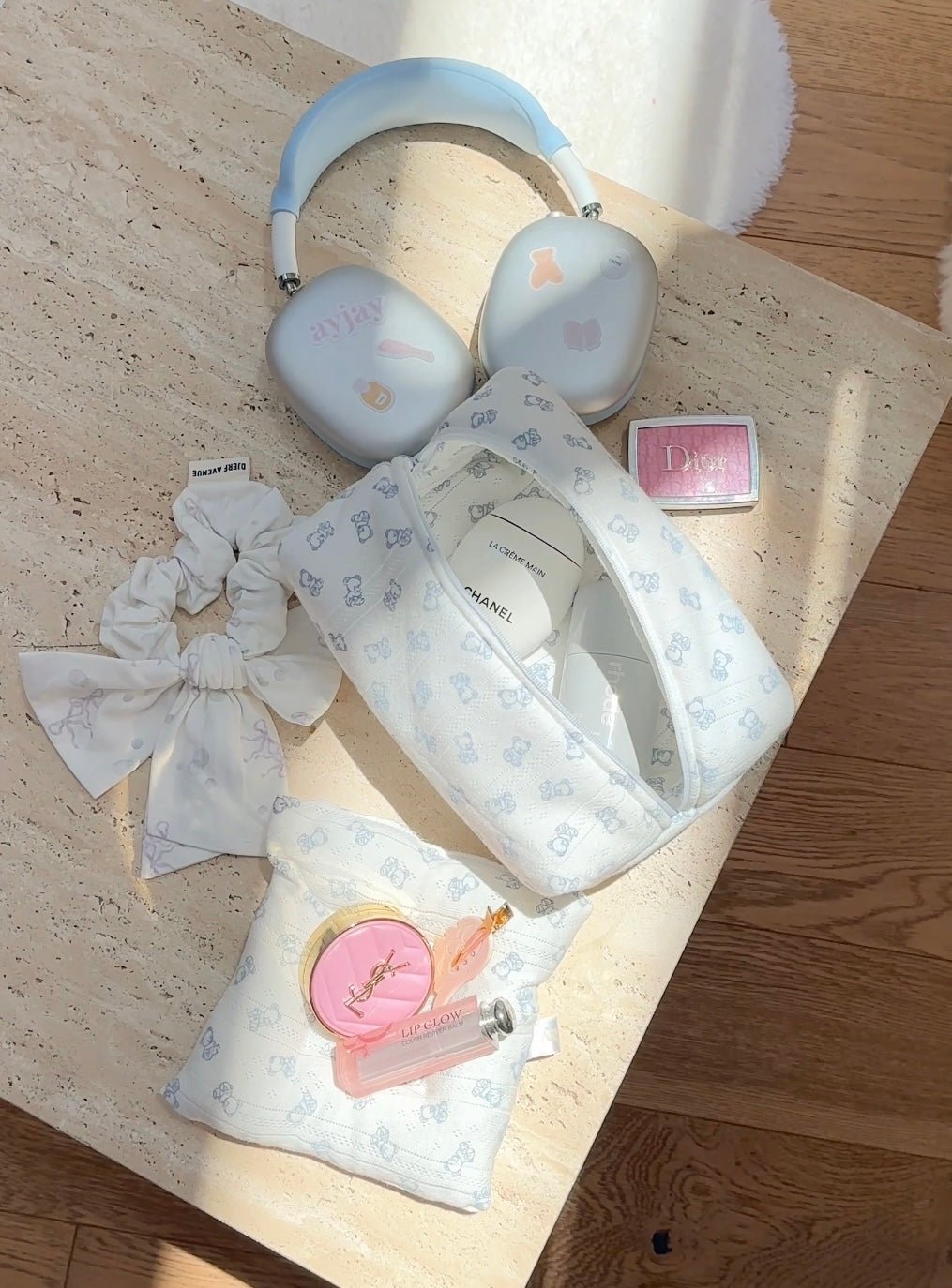 Light blue teddy bear and cloud print coaster set with bow detail and pink badge