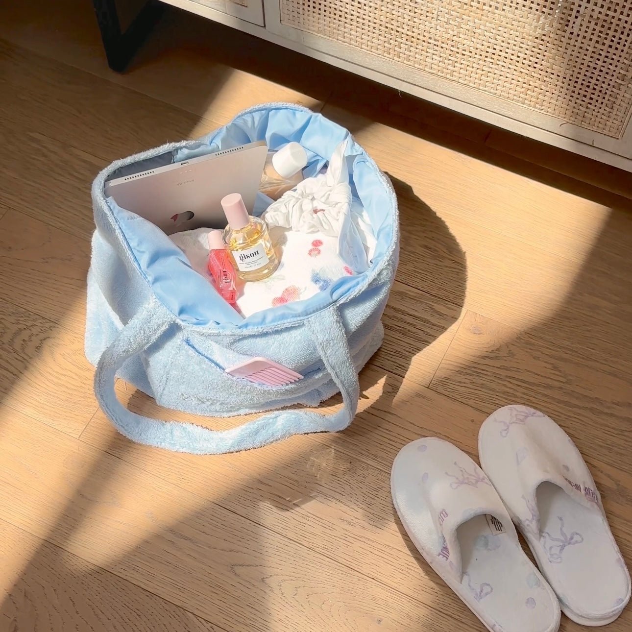 Light blue terrycloth tote bag with open interior and front pocket
