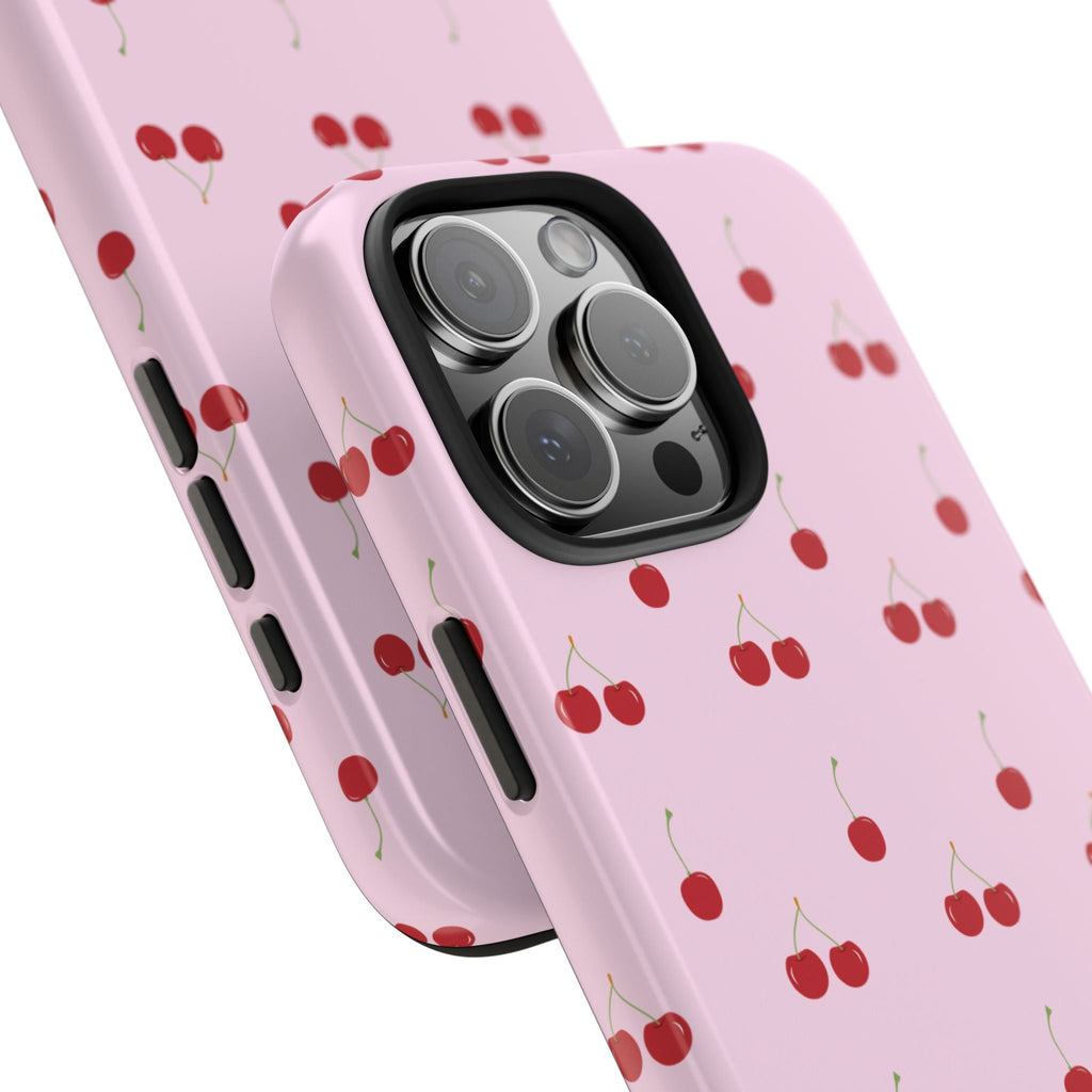 Corner view of baby pink cherry phone case with red fruit pattern and camera lens cover