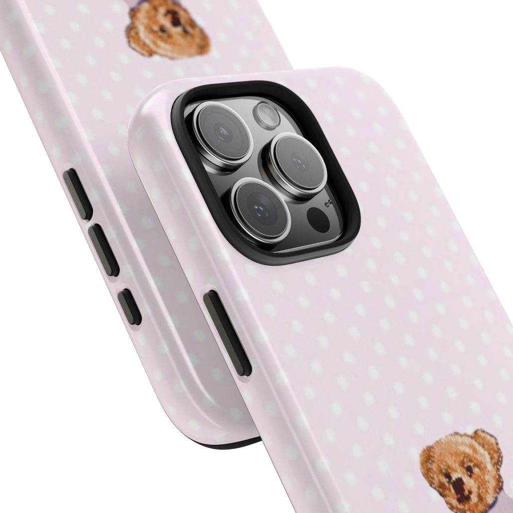 Light pink case with white polka dots; side buttons and camera cutouts, teddy face peeking