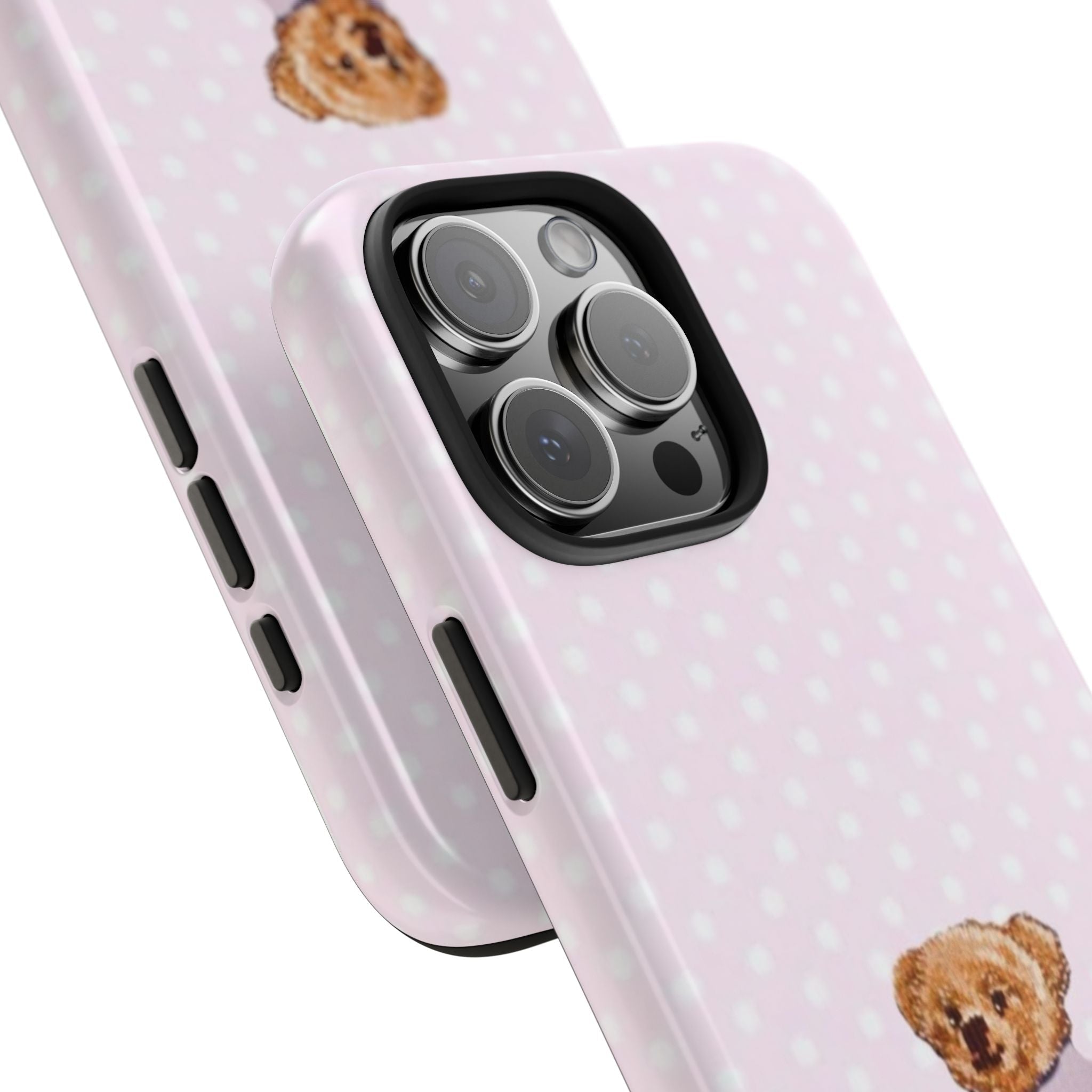 Light pink case with white polka dots; side buttons and camera cutouts, teddy face peeking