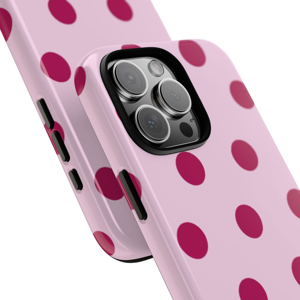 Side view of baby pink case with raspberry polka dots, camera lenses visible