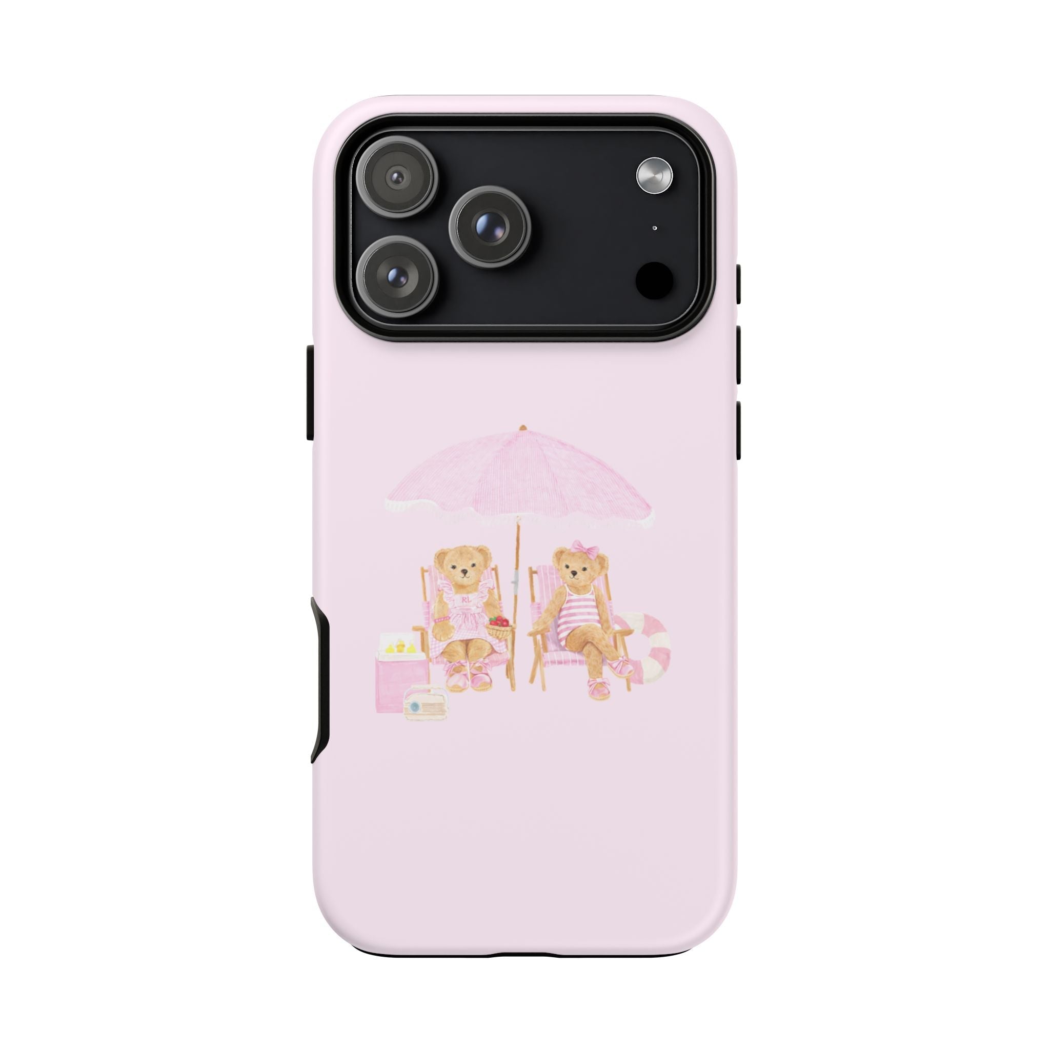 Baby pink phone case with teddy bears sitting at a beach table under a pink umbrella