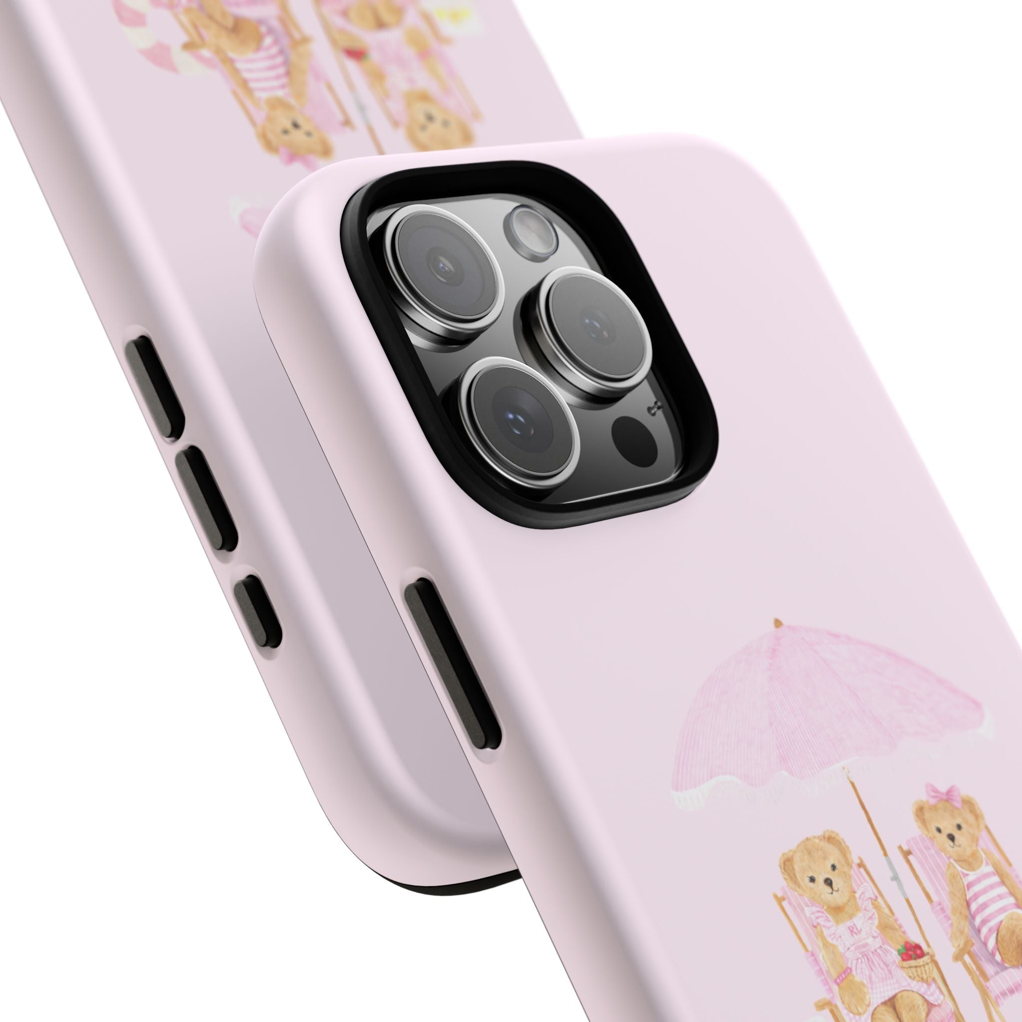Baby pink phone case corner close-up showing cutouts and teddy bear beach umbrella design