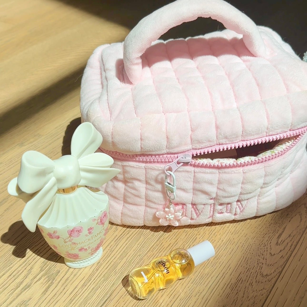 Pink lily flower bag charm: pale mint flower on a light pink quilted pouch