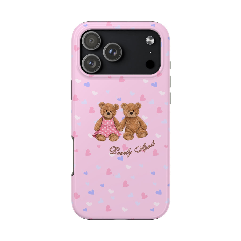 Pink phone case with teddy bear couple, hearts pattern, and "Bearly Apart" script