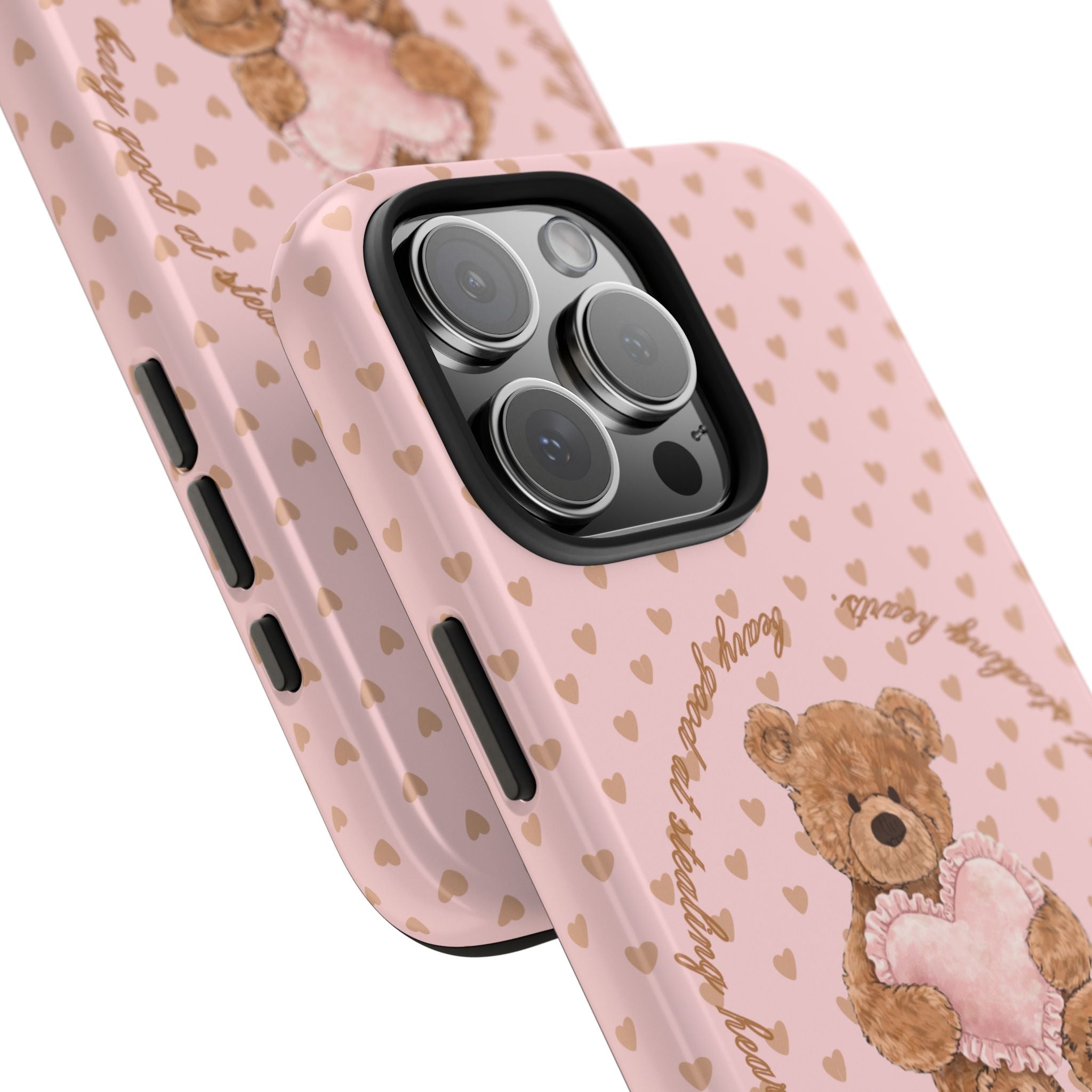 Corner view of pink phone case with bear-and-hearts design and camera cutouts