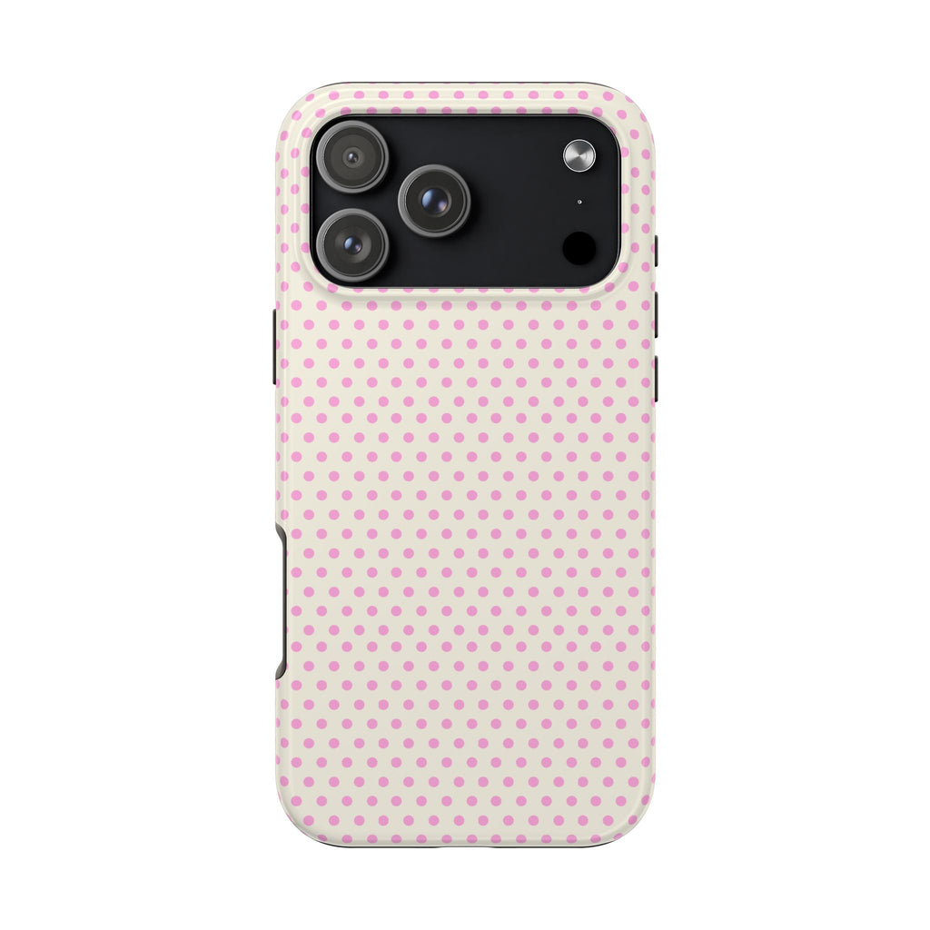Beige phone case with pink polka dots, raised camera cover and side buttons.