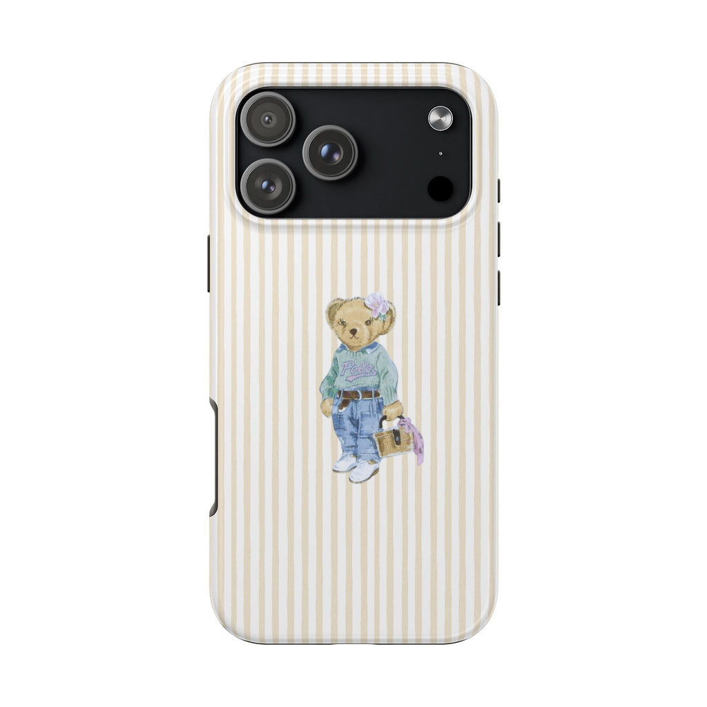 Beige striped phone case with teddy bear wearing overalls at center; camera cutout