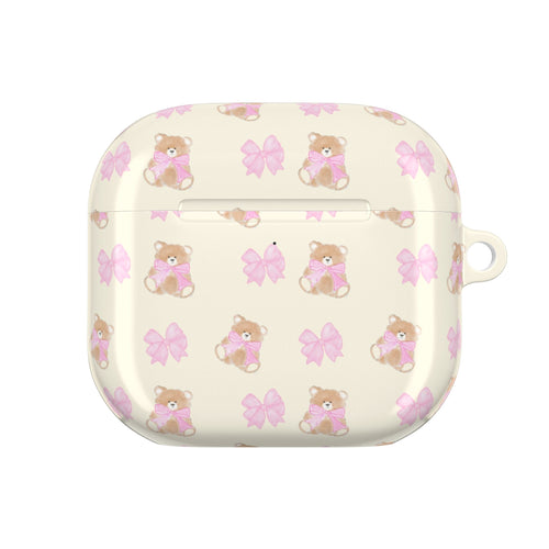 Beige AirPods case with teddy bear and pink bow pattern, front view