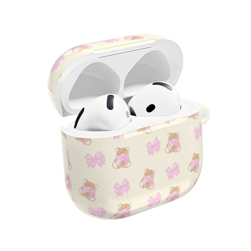 Beige AirPods case with teddy bear print, pink bows, open lid with earbuds