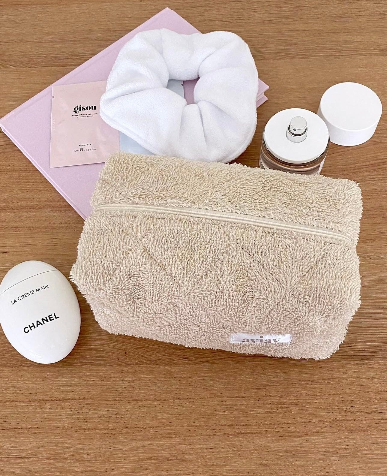 Beige terrycloth cosmetic pouch with wide top zipper