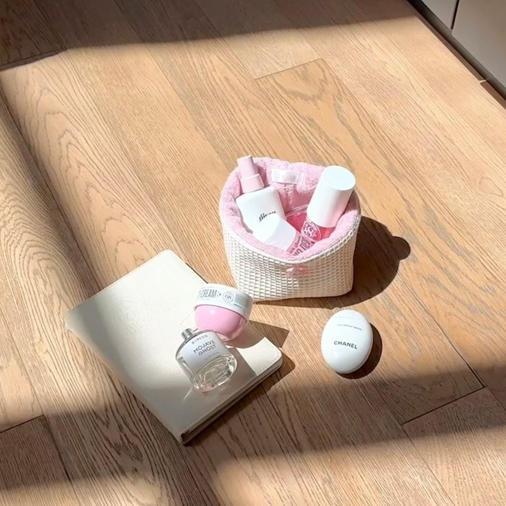 Small beige waffle-knit organizer basket with pink inner lining and open top