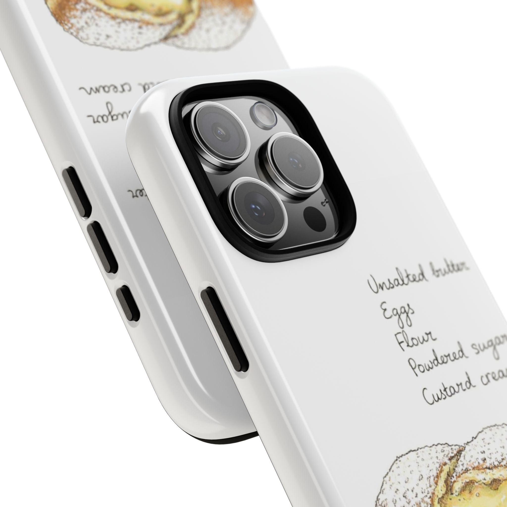 Close-up white phone case corner with custard beignet print, camera lenses, and side buttons