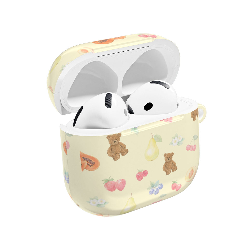 Light cream AirPods case with berry, fruit, and teddy bear print; hinged lid open