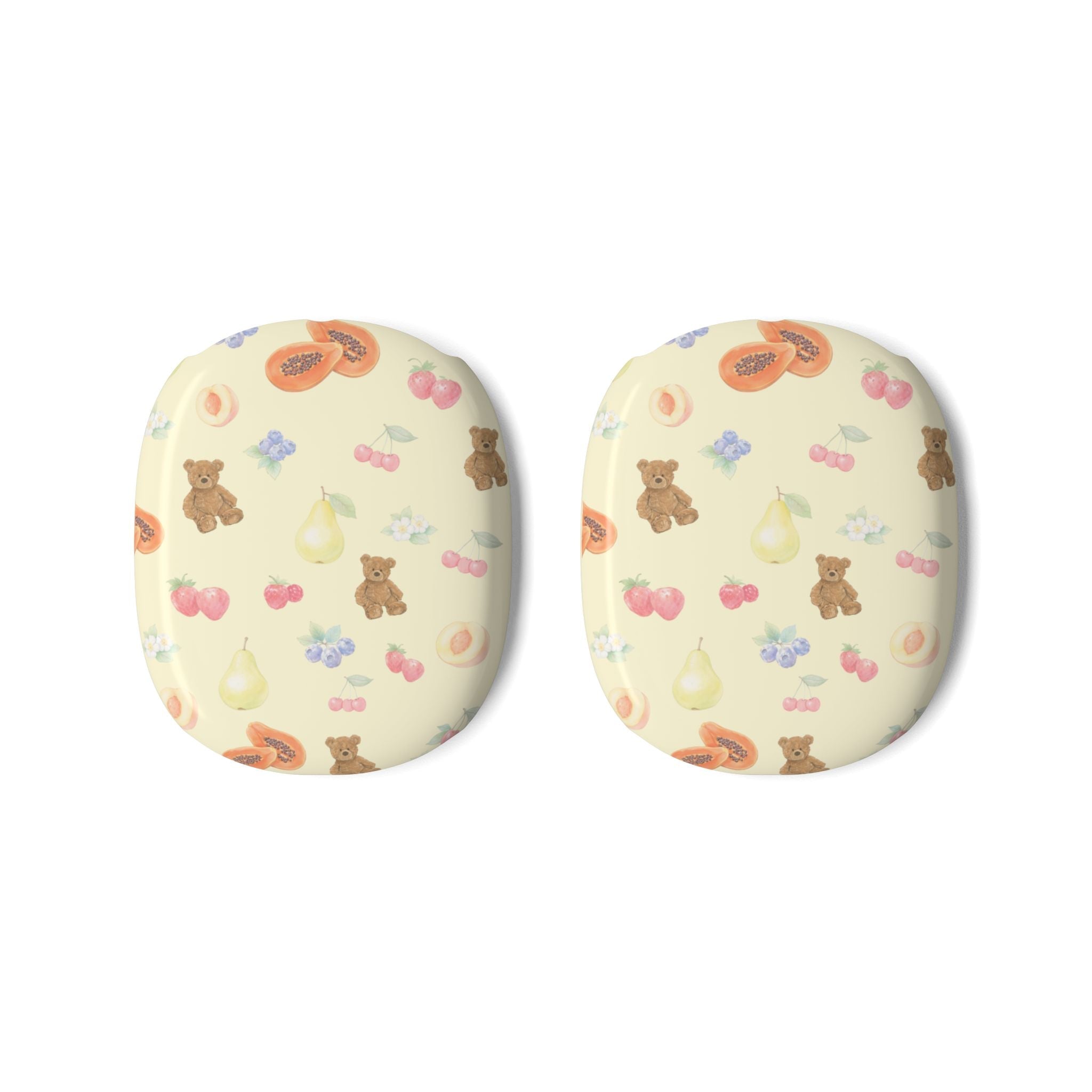 Two cream ear cover pads with cute bears, berries, and fruit icons pattern