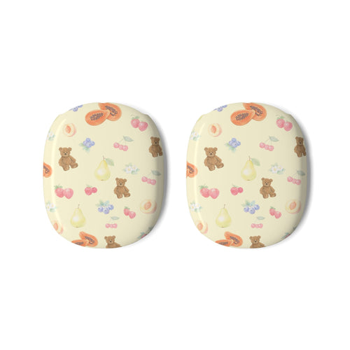 Two cream ear cover pads with cute bears, berries, and fruit icons pattern