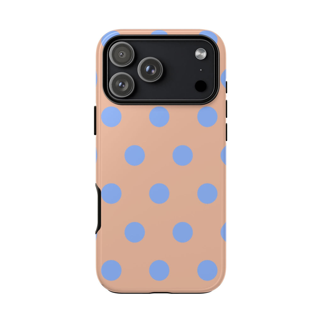 Front view phone case: peach base with blue polka dots, black camera cover