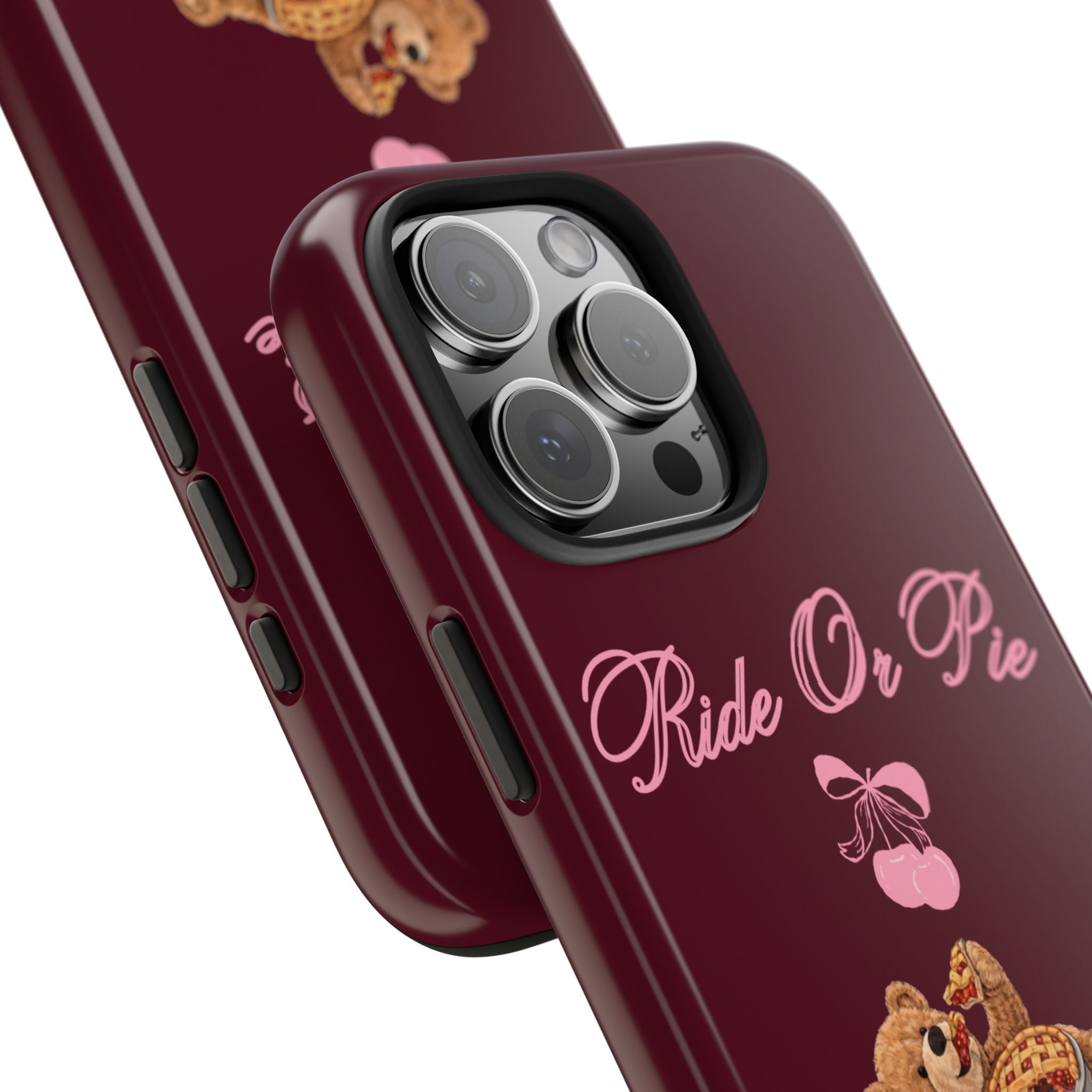 Close-up maroon phone case with camera cutouts and “Ride Or Pie” text