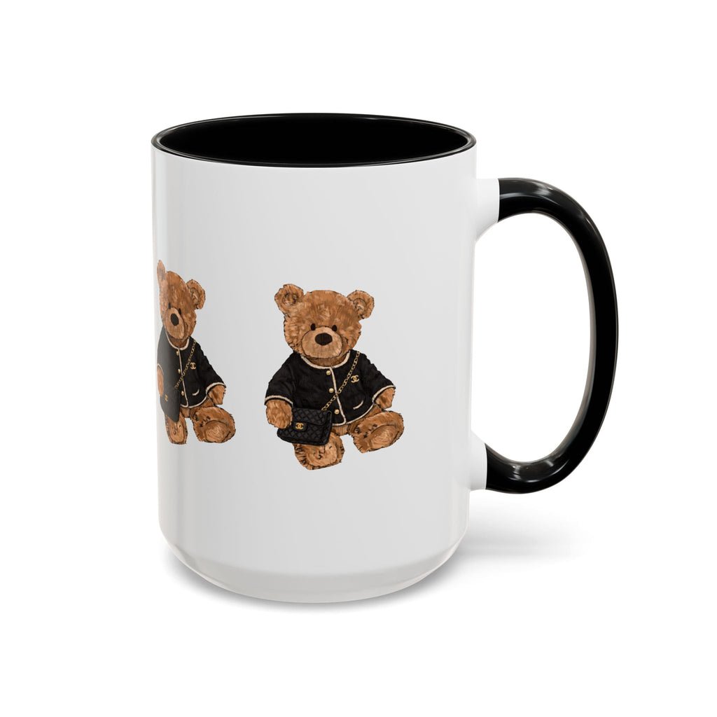 White ceramic mug with black rim and handle, teddy bear in dark outfit graphic