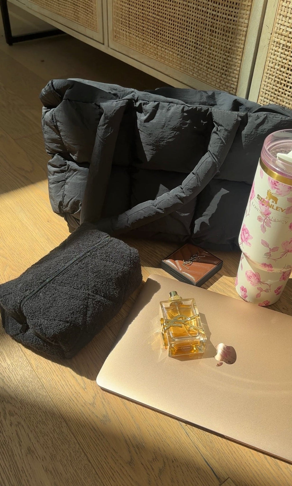 Rolled dark terrycloth zip pouch, shown opened with soft fabric padding