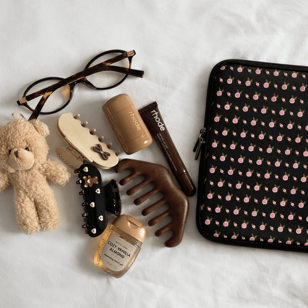 Black neoprene sleeve with pink ditsy floral print and zip closure for Kindle/iPad/laptop