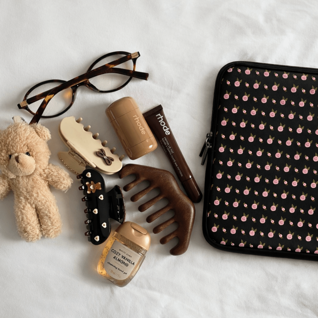 Black neoprene sleeve with pink ditsy floral print and zip closure for Kindle/iPad/laptop