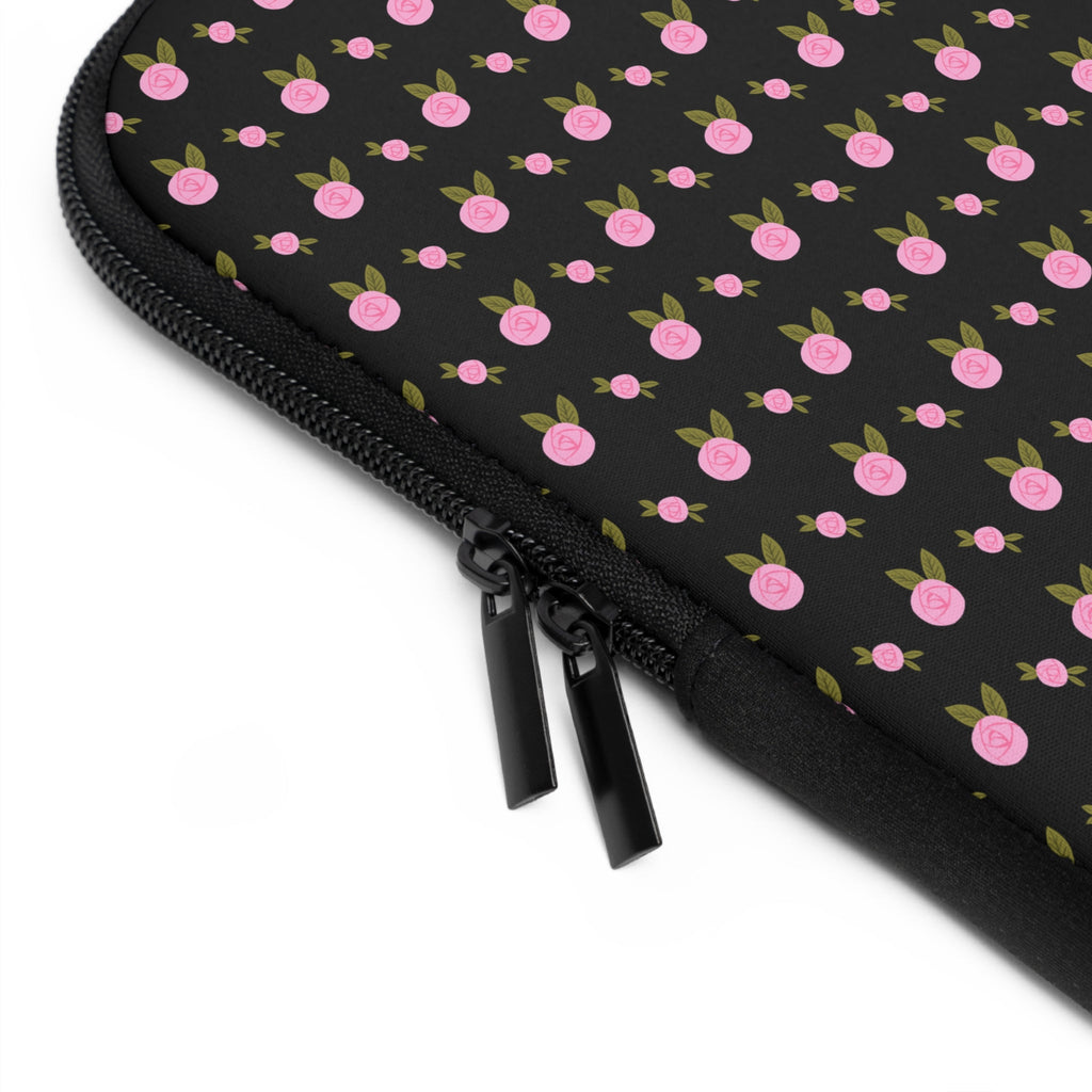Close-up of black zipper on pink ditsy floral neoprene sleeve edge