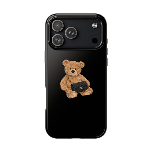 Black phone case with teddy bear holding a small flap bag charm