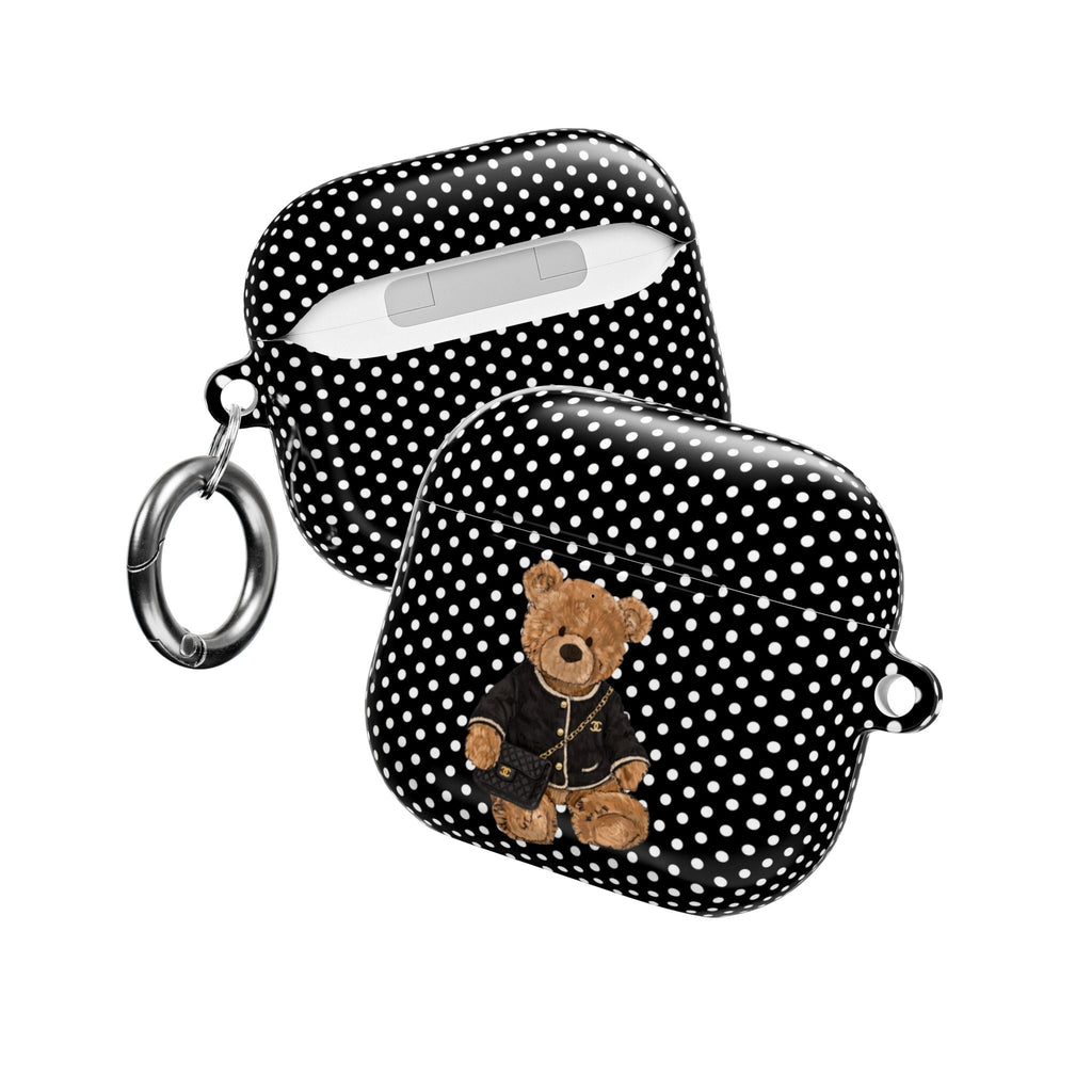 Black-and-white polka dot AirPods case with teddy bear design and keychain ring