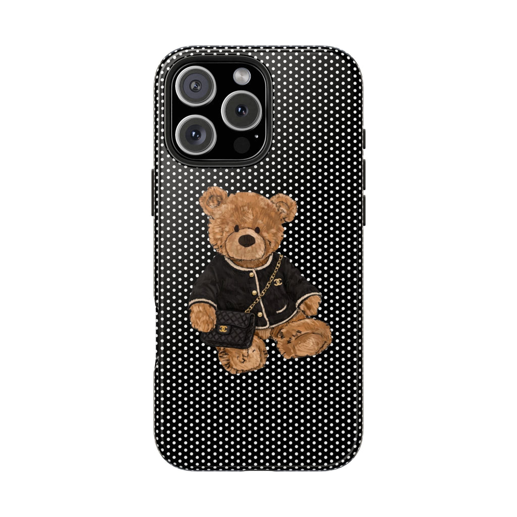 Black case with white polka dots, teddy bear in jacket holding mini purse