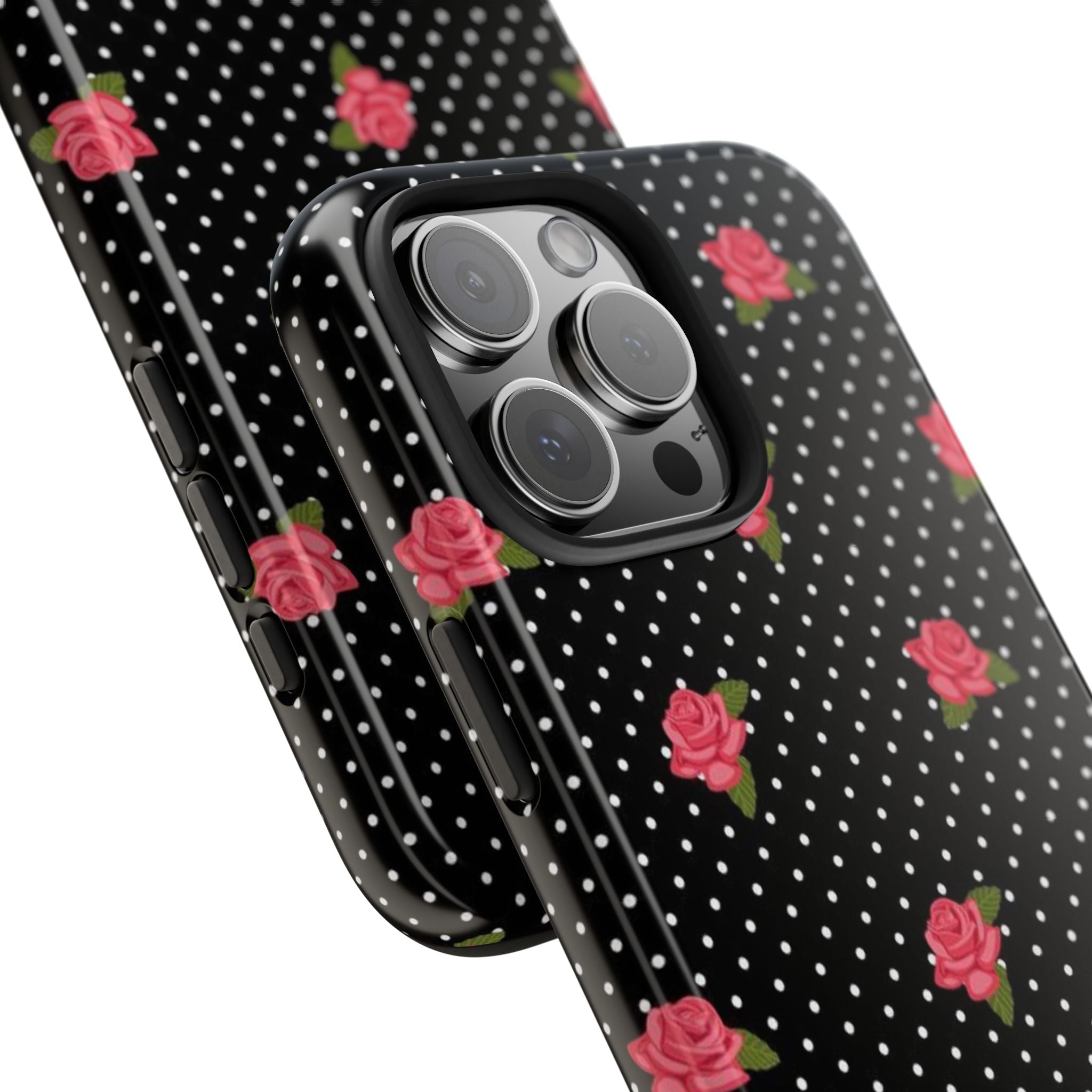 Angled phone case with black-and-white polka dots, pink roses, and camera lens cutouts