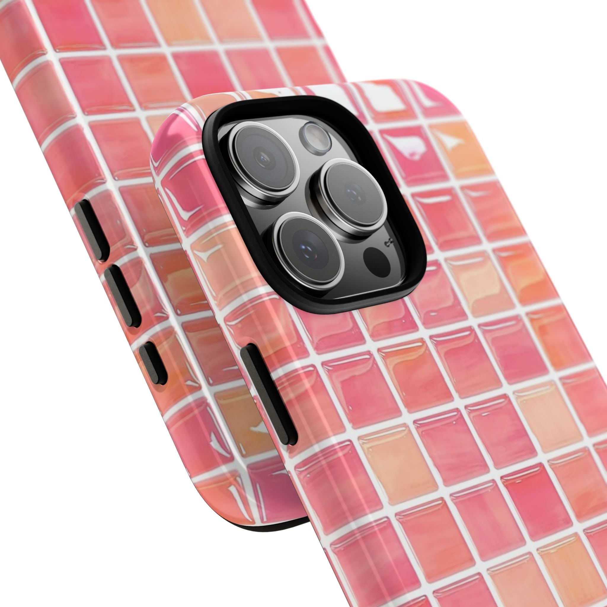 Blood orange mosaic phone case with pink tile grid, side openings, and raised camera module