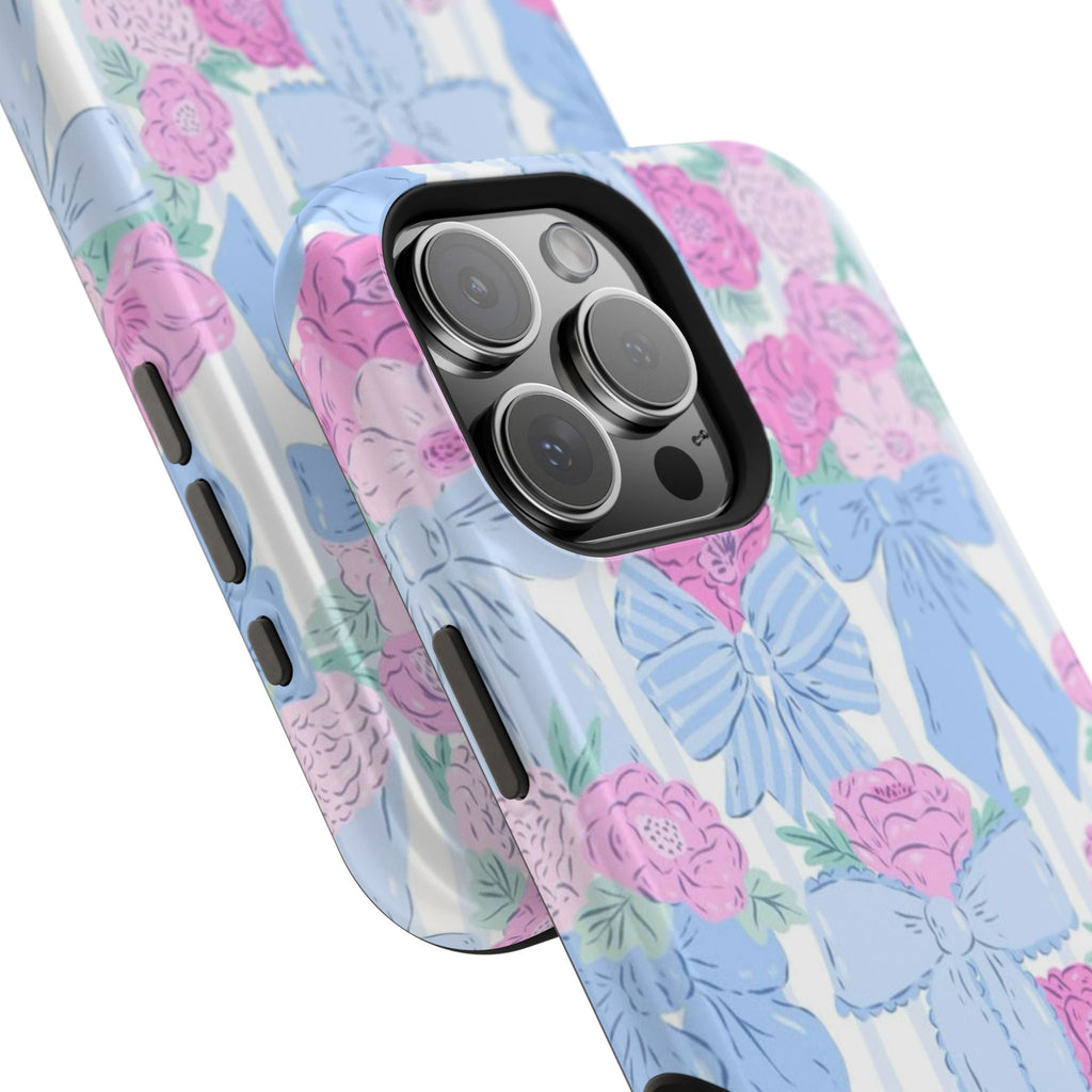Floral phone case close-up with bow and blossom print, raised camera cutout