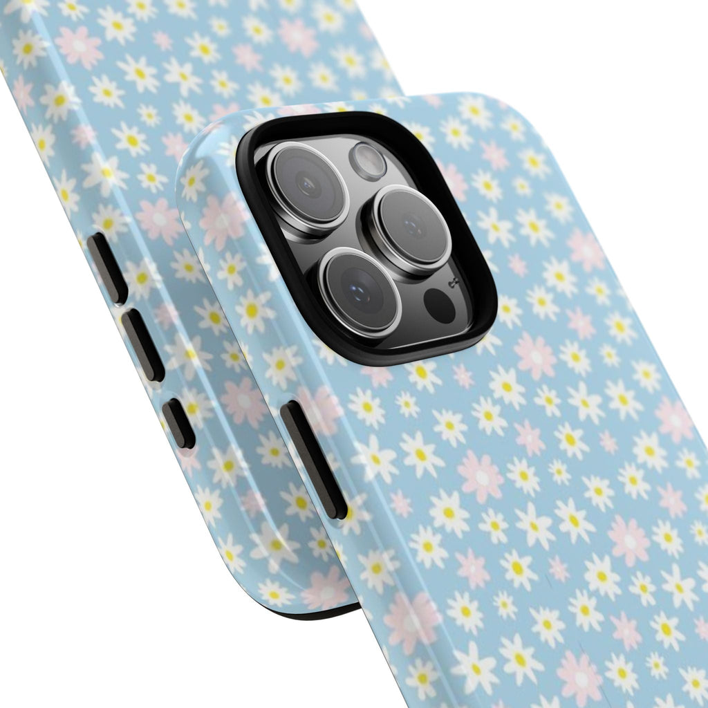 Blue daisy floral phone case with side button cutouts, angled view