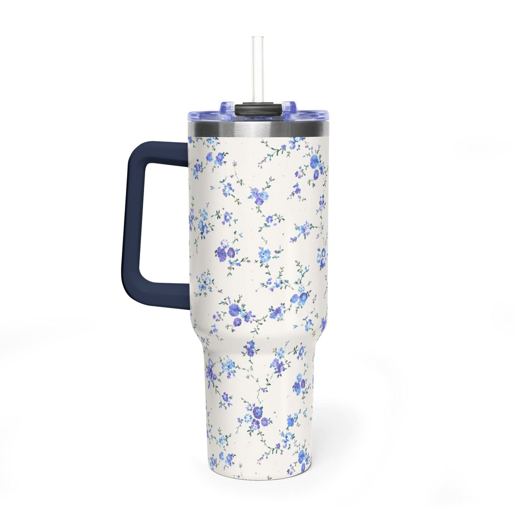 Floral stainless tumbler with navy carry handle, clear straw lid, blue-purple ditsy print