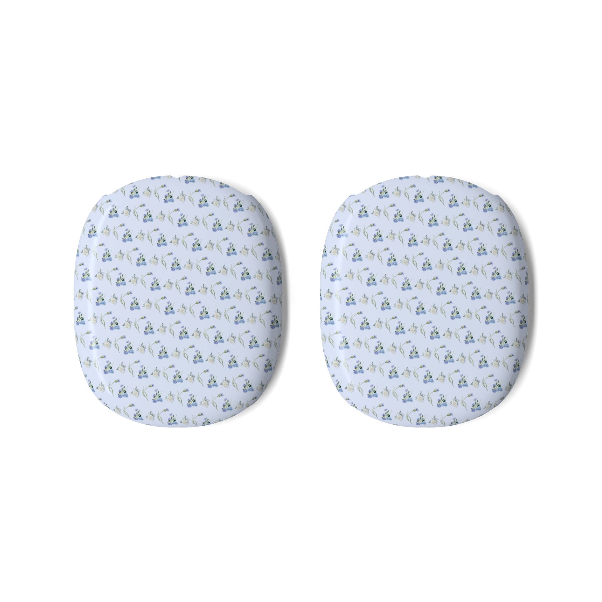 Pair of AirPods Max ear cup covers with blue ditsy floral pattern on light fabric
