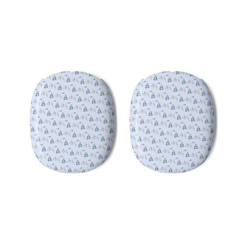 Pair of AirPods Max ear cup covers with blue ditsy floral pattern on light fabric