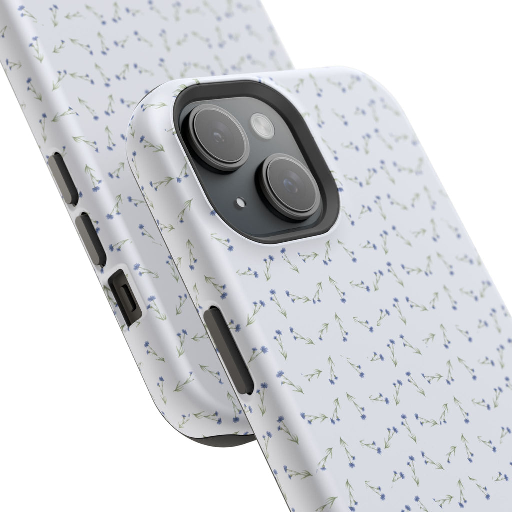 Blue ditsy floral phone case in white; angled view shows camera cutout and side buttons.