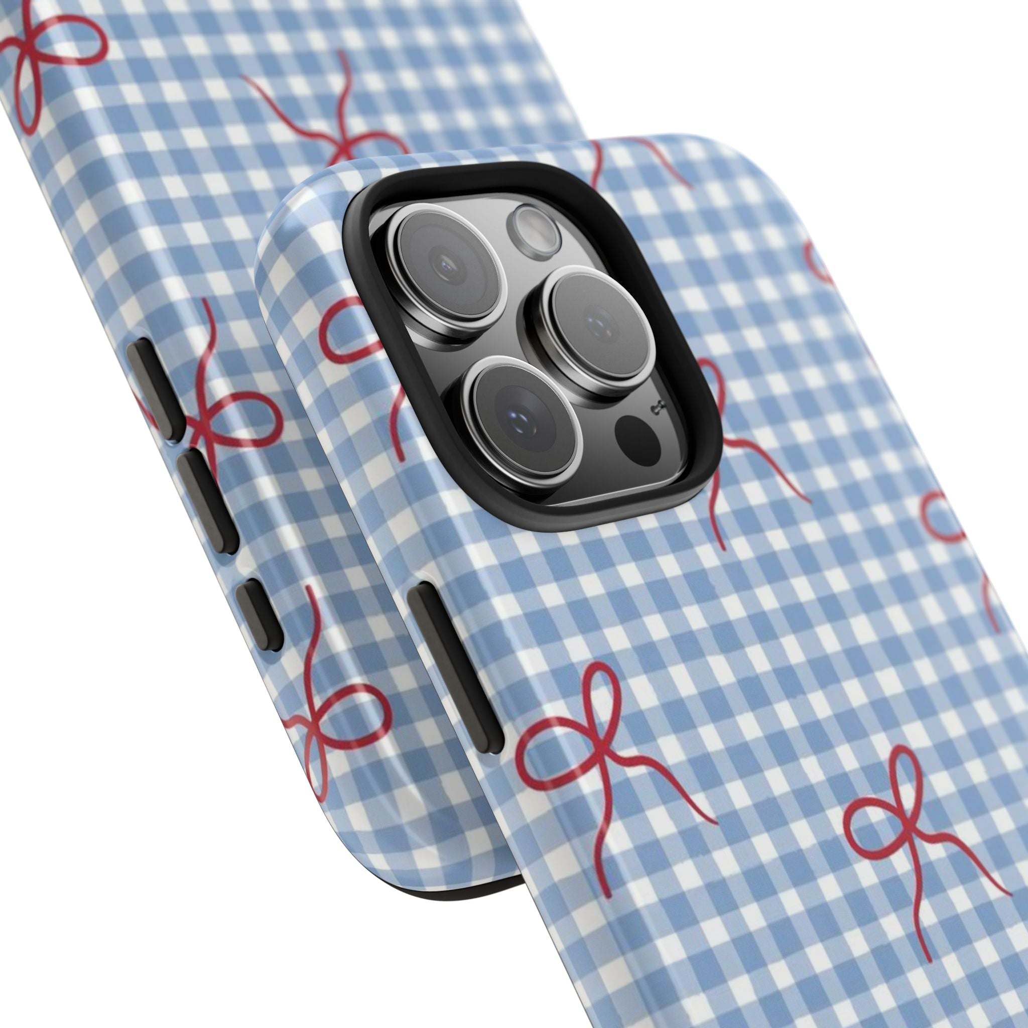 Blue gingham phone case corner view with red bow print and raised camera lens