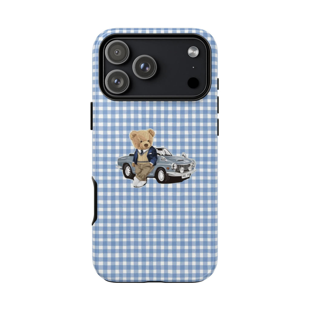 Blue check phone case with teddy bear and vintage car print; top camera lenses visible