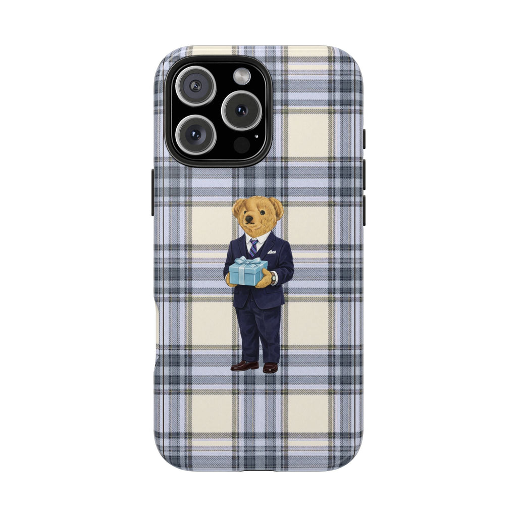 Blue plaid phone case with teddy bear in suit holding gift centered on back, camera