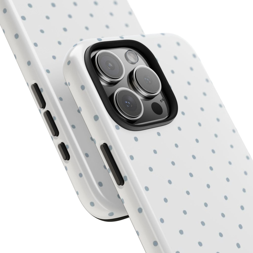 Close-up phone case with blue polka dot pattern and camera cutout