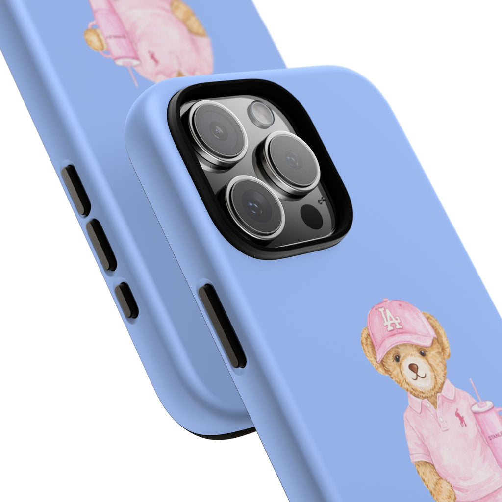 Blue phone case close-up: camera cutout and side buttons with teddy bear graphic