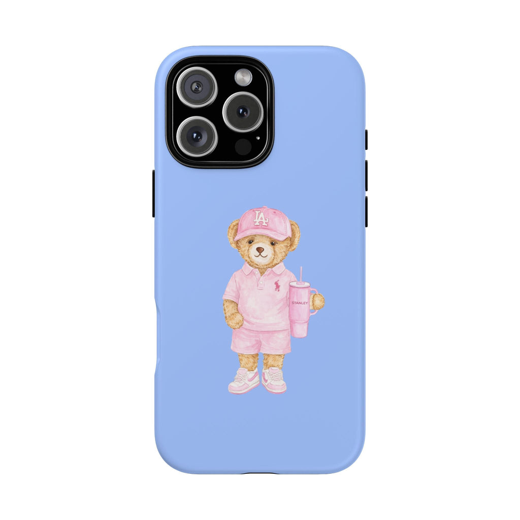 Blue phone case with pink teddy bear wearing a cap, holding a drink