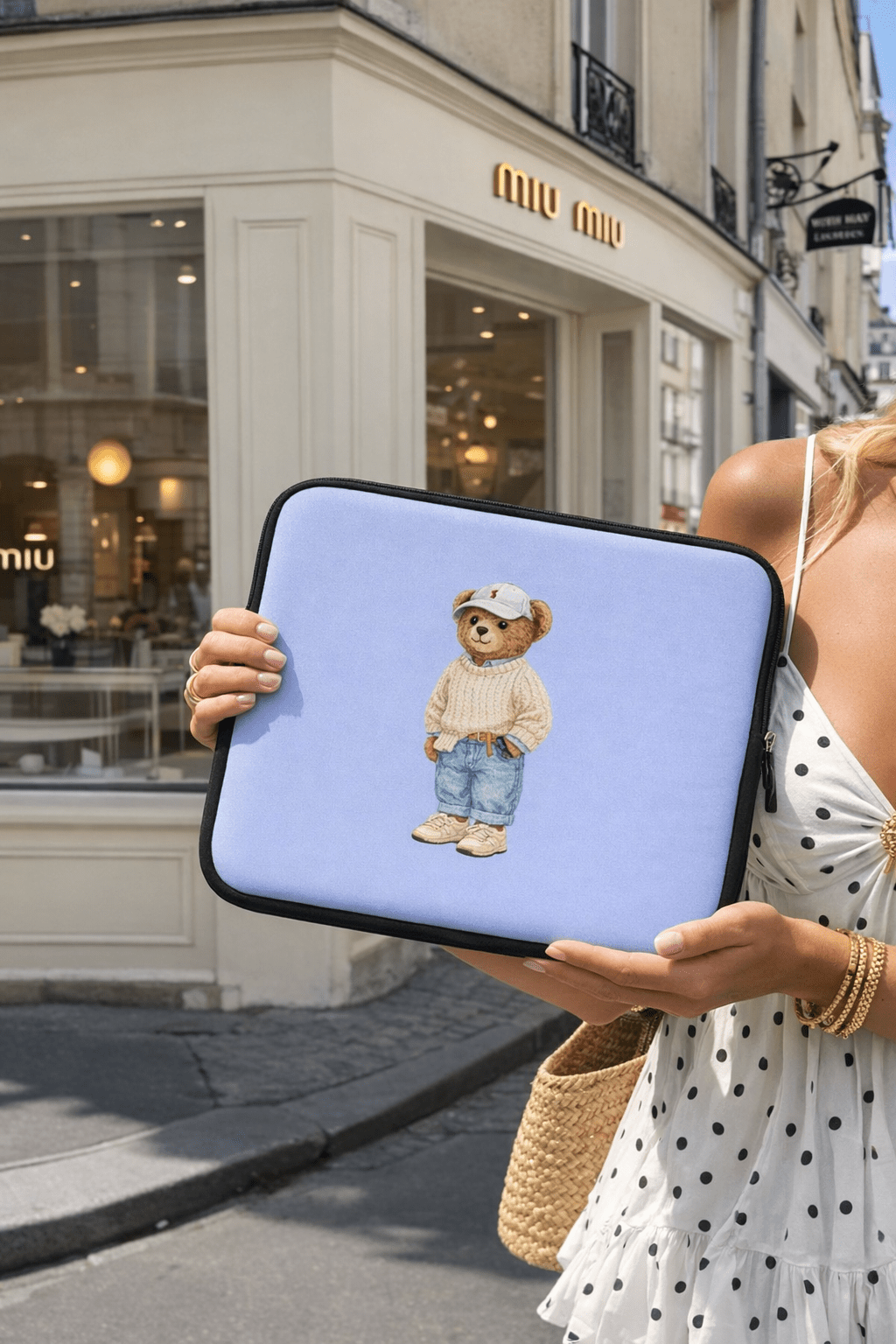 Light blue neoprene tablet/kindle sleeve with black zipper and teddy bear patch