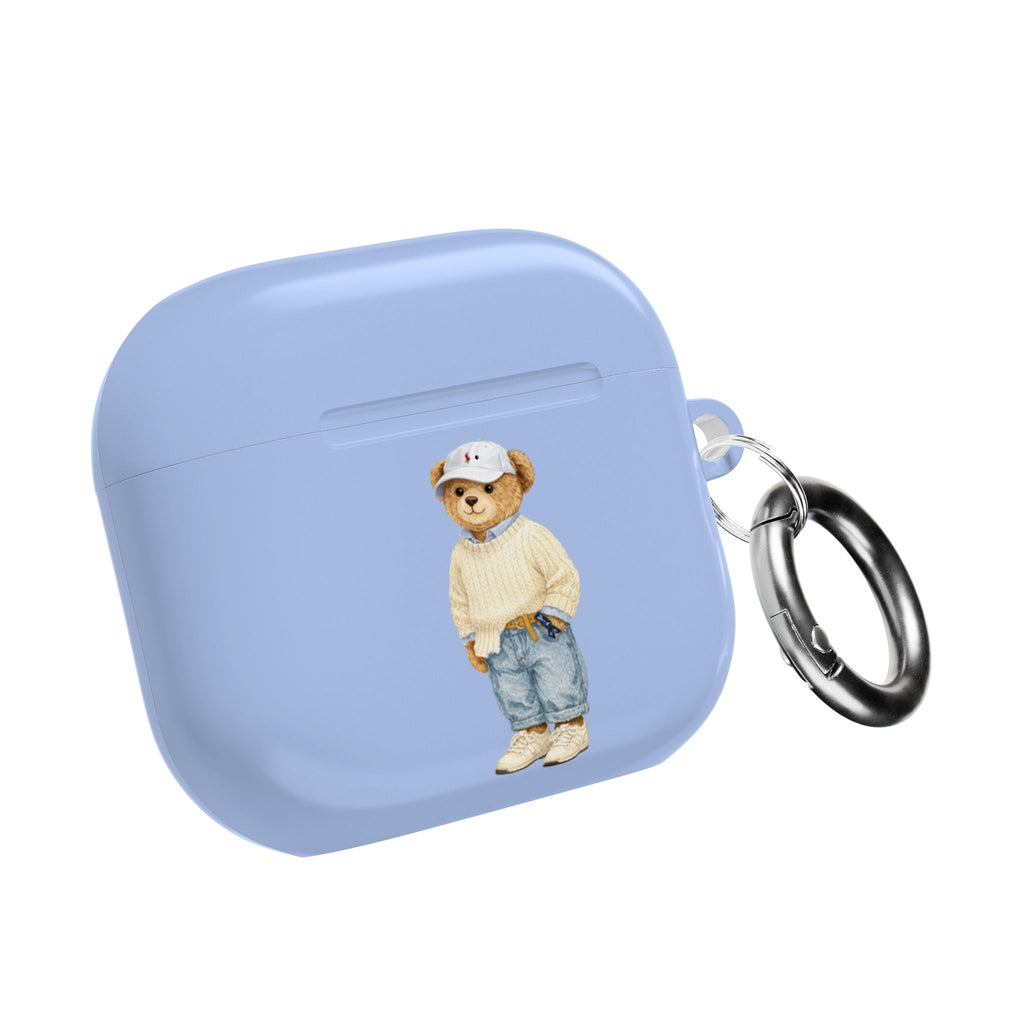 Light blue AirPods case with teddy bear graphic and metal keyring, closed