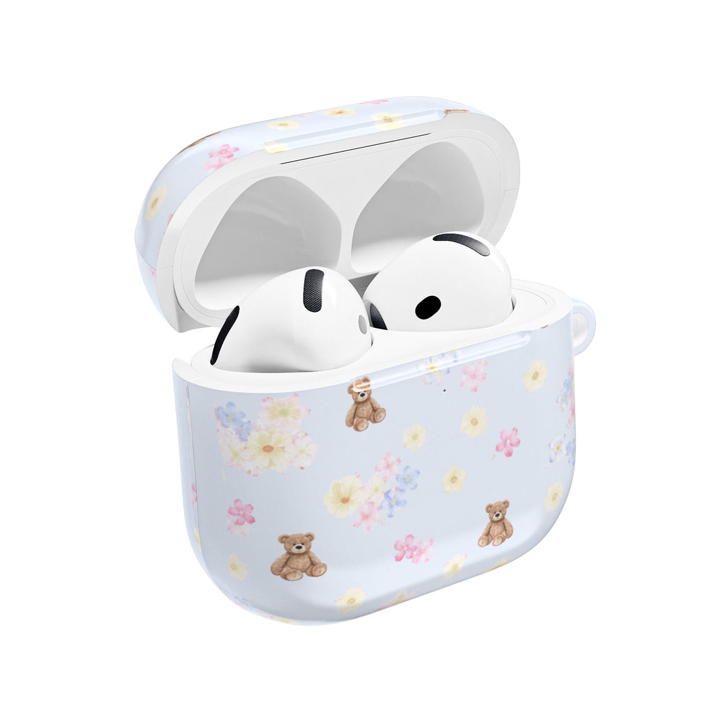 Light blue AirPod case with floral bear print, open for earbuds.