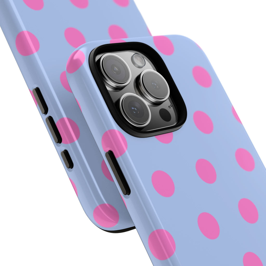Close-up of light blue phone case with pink polka dots; dual camera cutout and lens detail